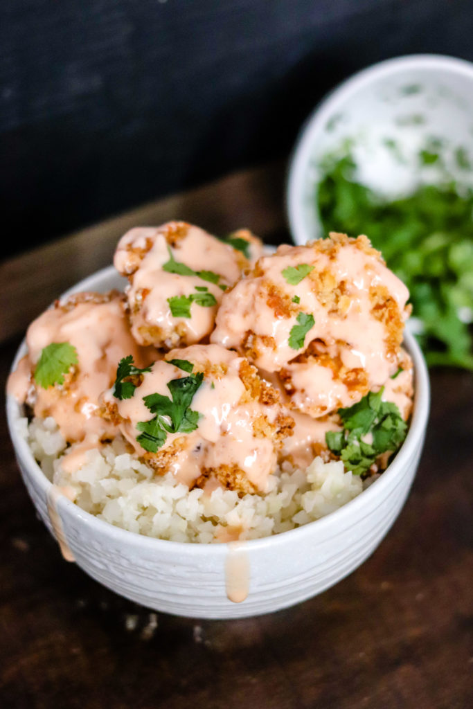 Air Fryer Bang Bang Shrimp are topped with a healthier version of the classic delicious sweet and spicy Bang Bang Sauce. They