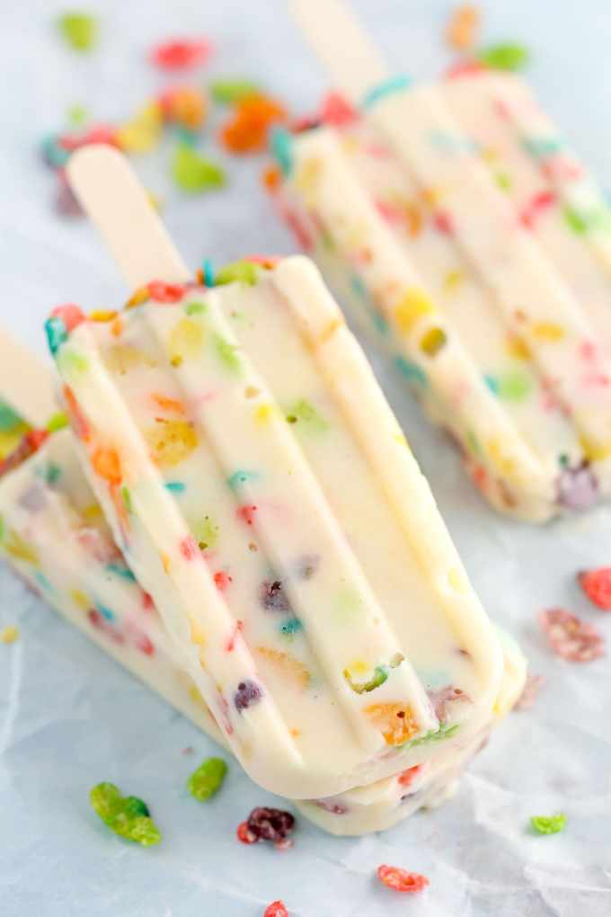 Three ingredient pudding pops filled with Marshmallow Fruity Pebbles! These Marshmallow Fruity Pebbles Pudding Pops make an easy and delicious treat!