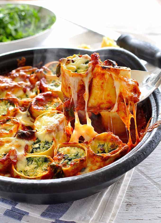 Baked Spinach and Ricotta Rotolo being served