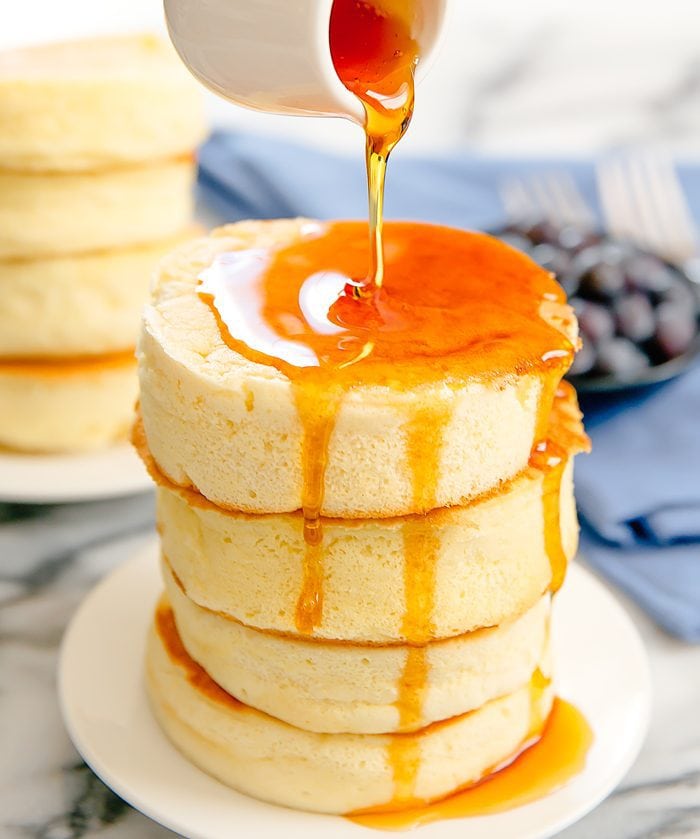 syrup being poured over a stack of Japanese Souffle Pancakes