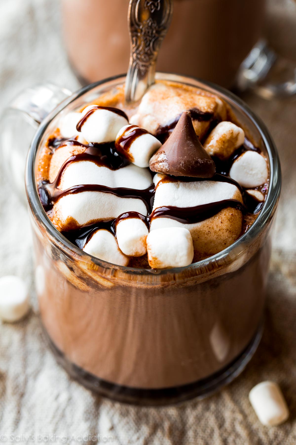 Creamy, rich, and decadent slow cooker hot chocolate made in the crockpot! Recipe on sallysbakingaddiction.com