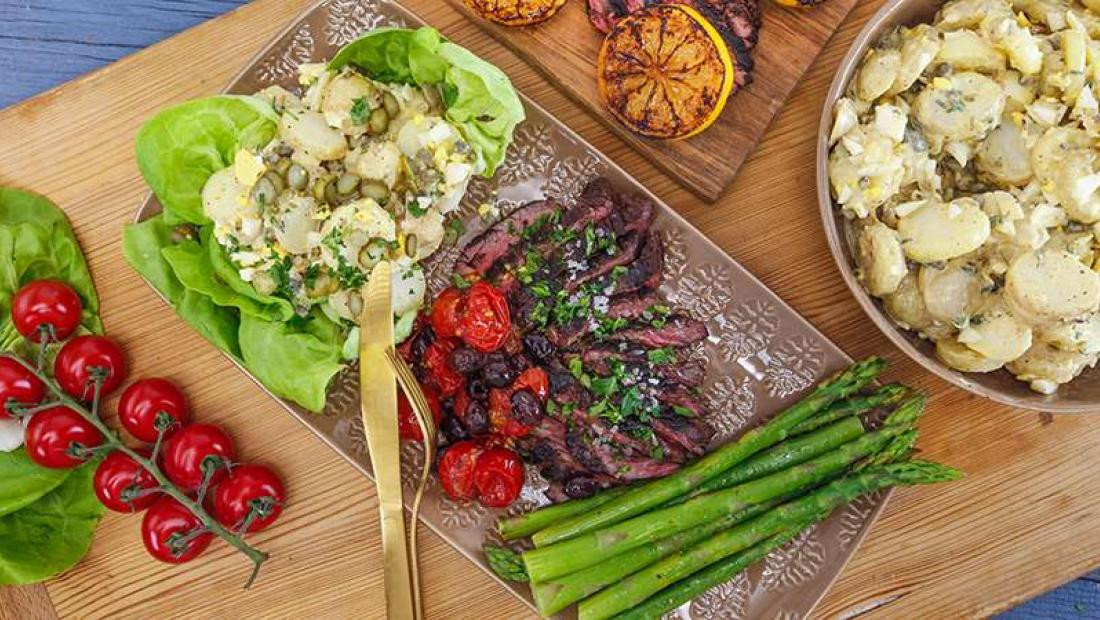 Sliced Hanger Steak with Roasted Tomatoes, Olives, Potato Salad with Dijon and Egg, Asparagus with Lemon