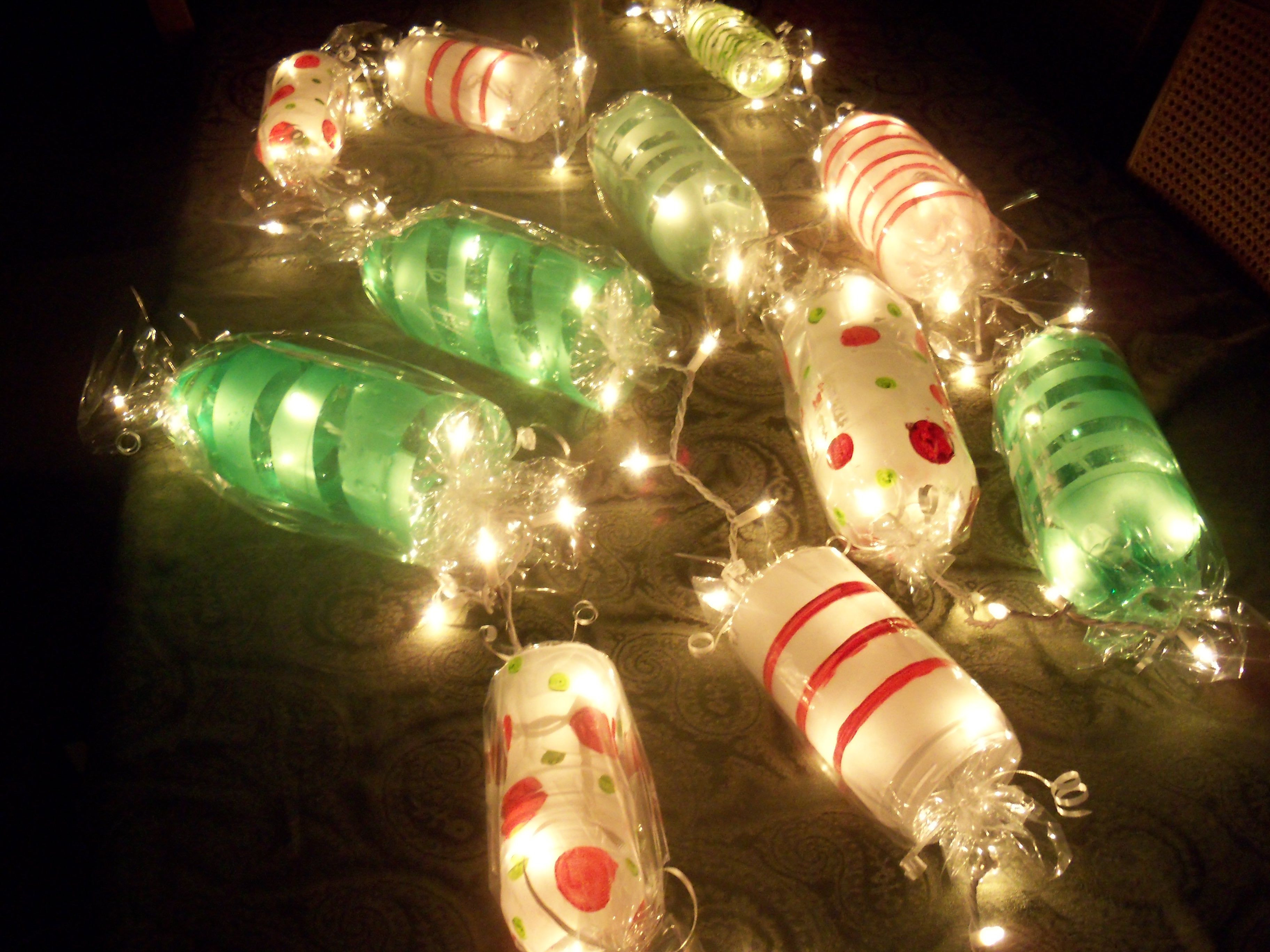Candy Christmas Lights
 Light up Candy Garland Cut ends off soda bottles paint