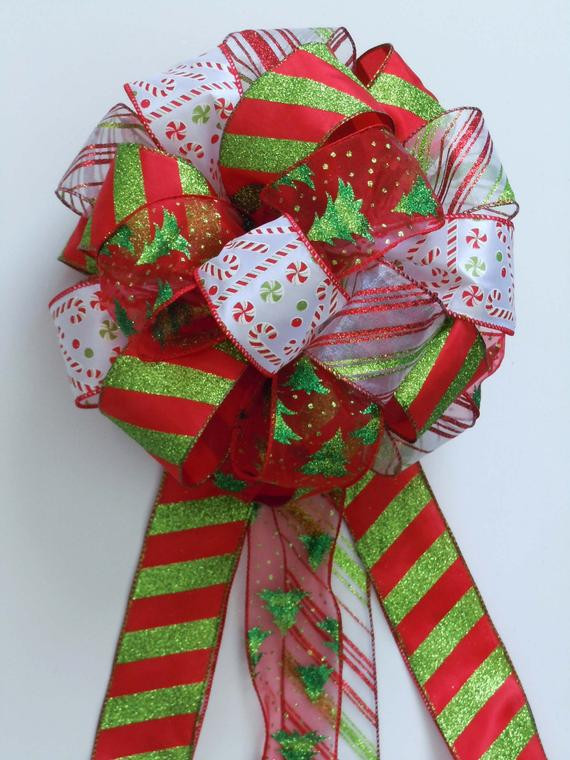 Candy Christmas Tree Topper
 Items similar to Christmas Bow Tree Topper Bow Candy Cane